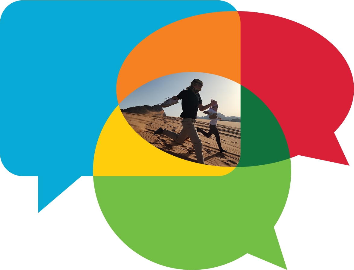 A logo for NSLIY shows four speech bubbles, colored blue, orange, red, and green, overlapping to form a circular shape. In the center, within the overlapping area of the bubbles, is a photograph of two people running in the desert.